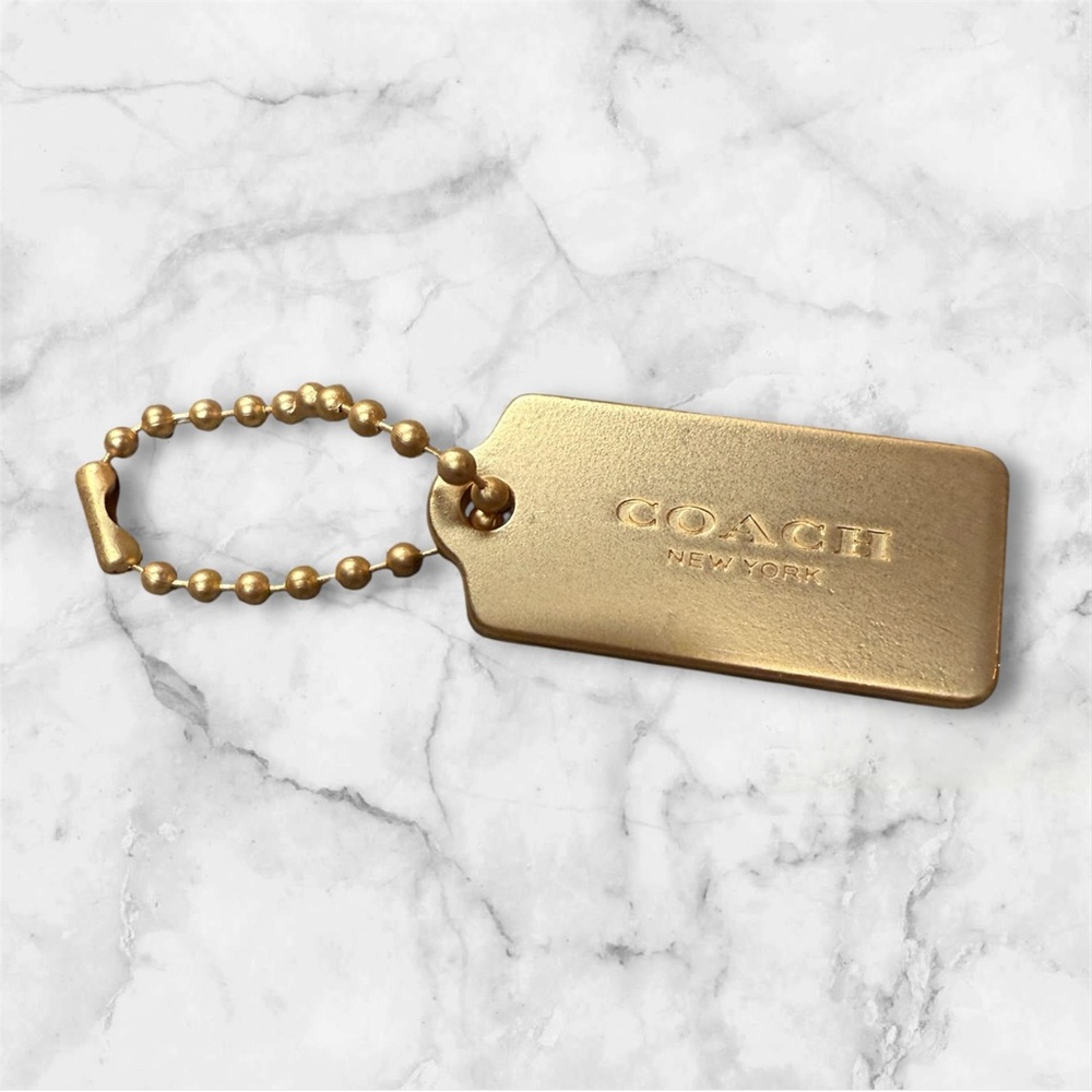 COACH Gold Tag Keychain - COACH New York Signature